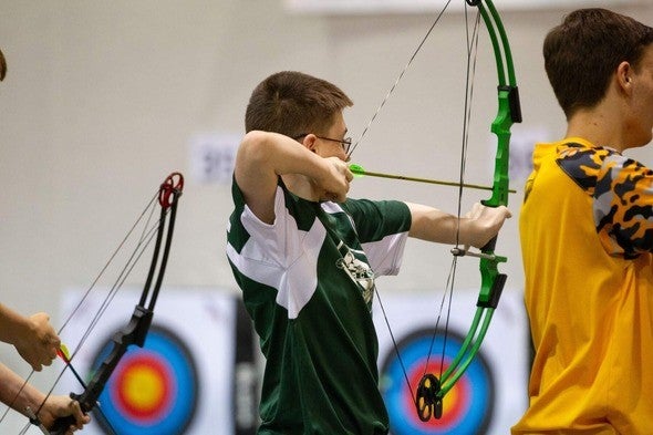 Young archer practices target shooting