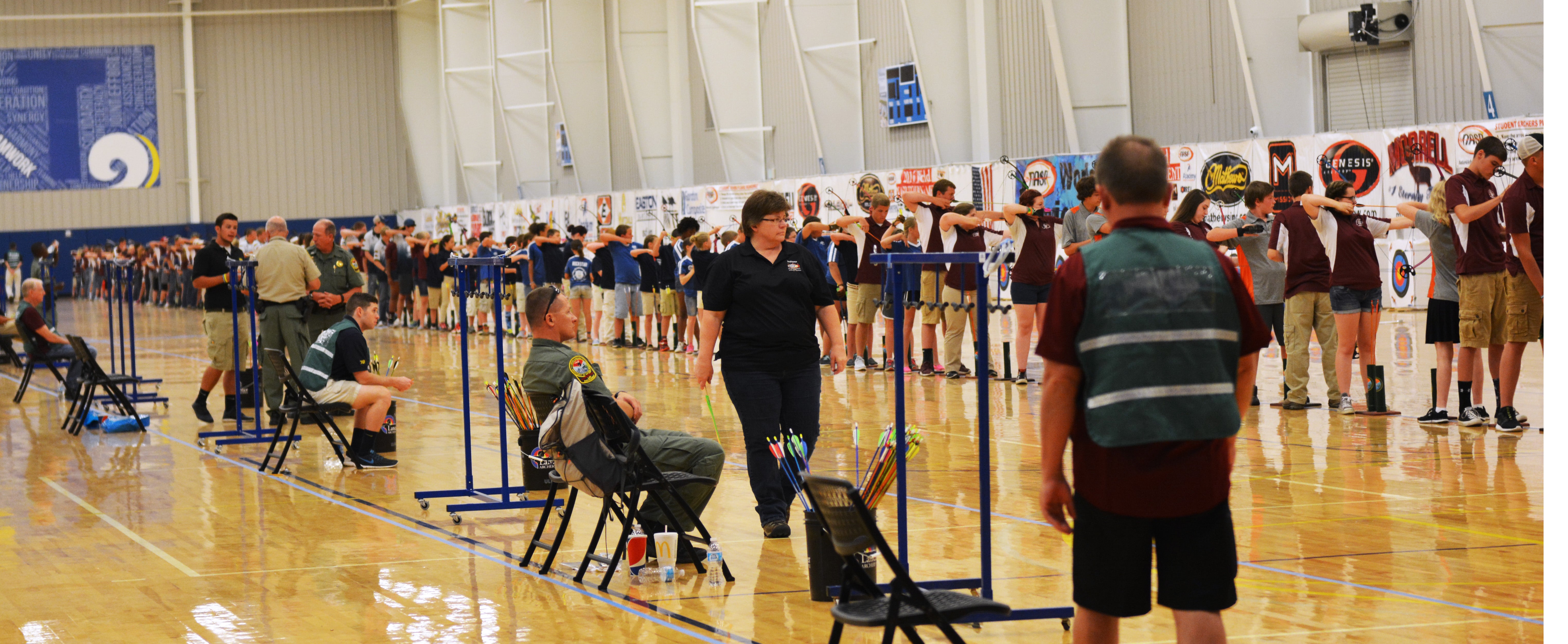 Students shooting their bows during the NASP World Archery Tournament