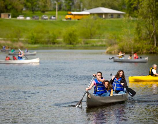 Discover Nature Students ride a canoe on a Hartell lake