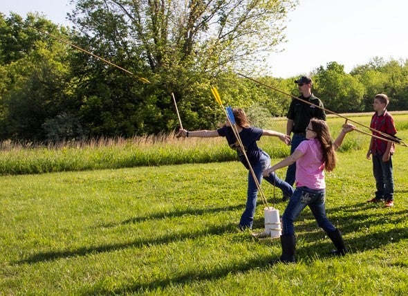teaching atlatl to kids