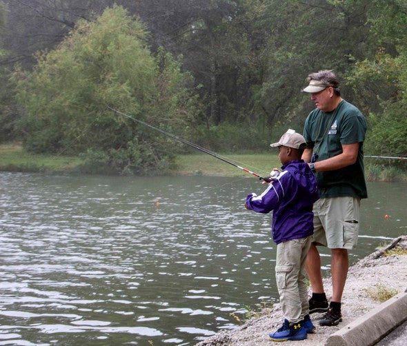 teaching boy to fish