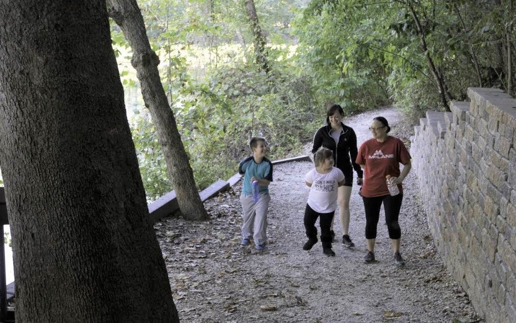 four people hiking