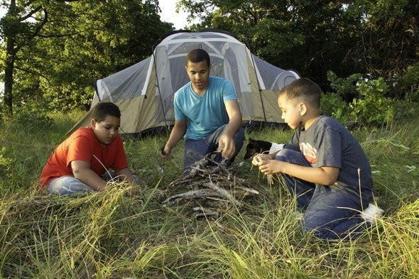 three people camping