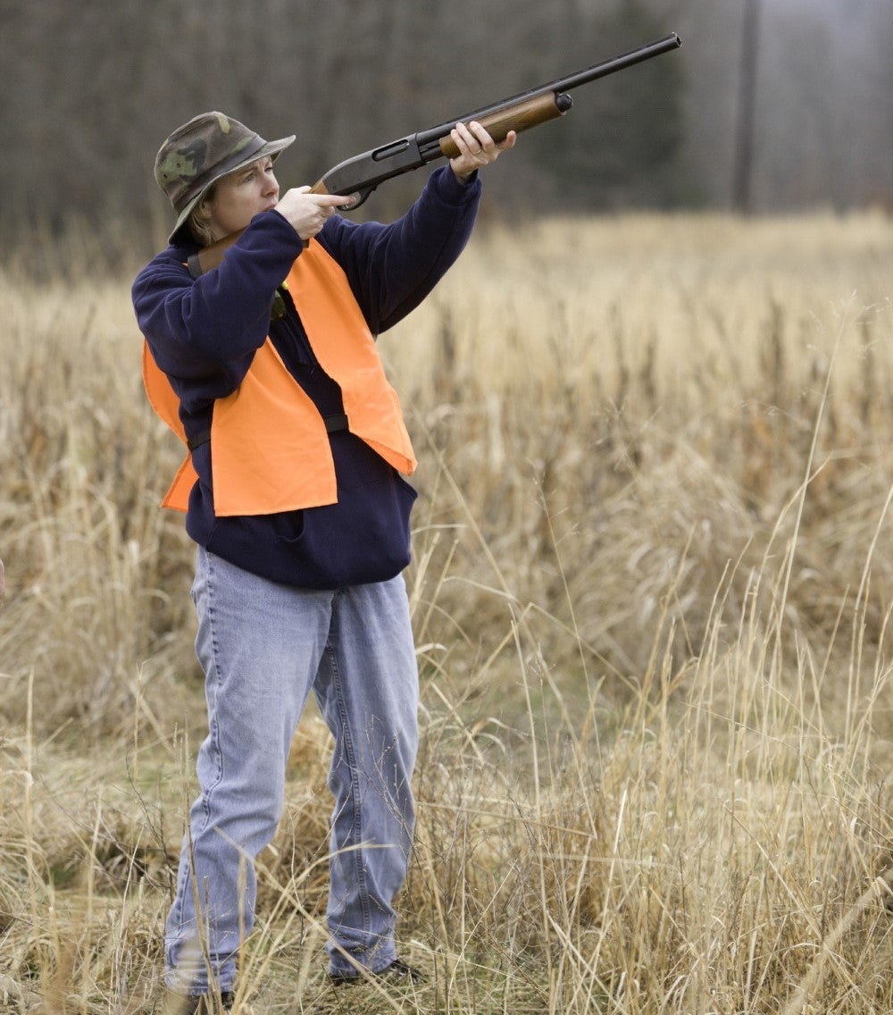 woman shooting shotgun