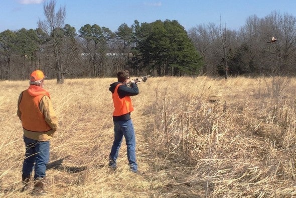 Men pheasant hunting