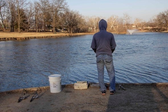 Angler looks at lake