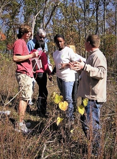 students look at flowers