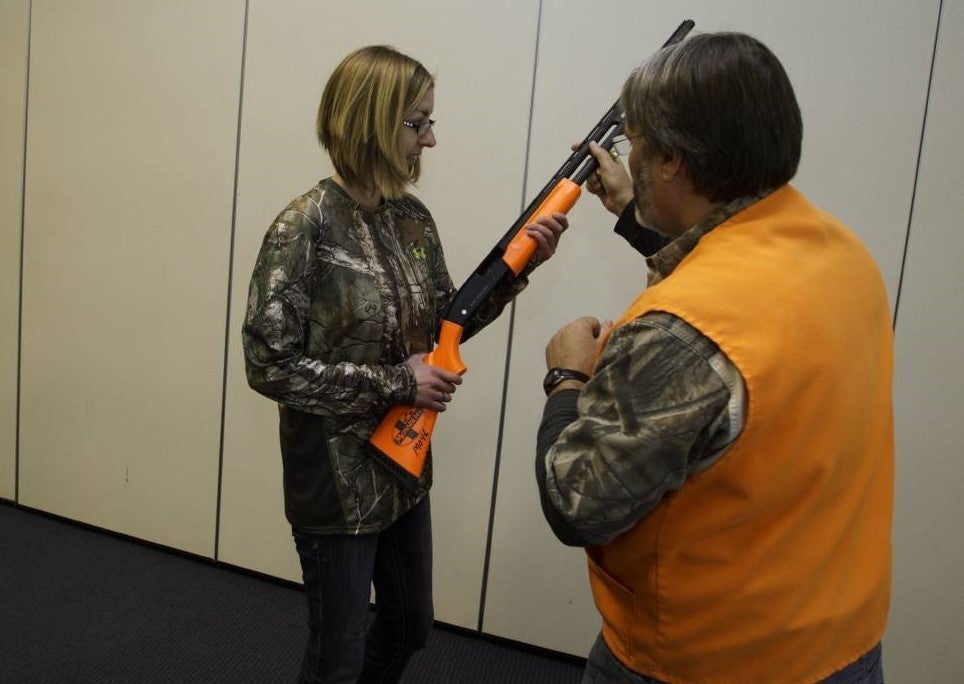 Woman takes hunter ed skills session