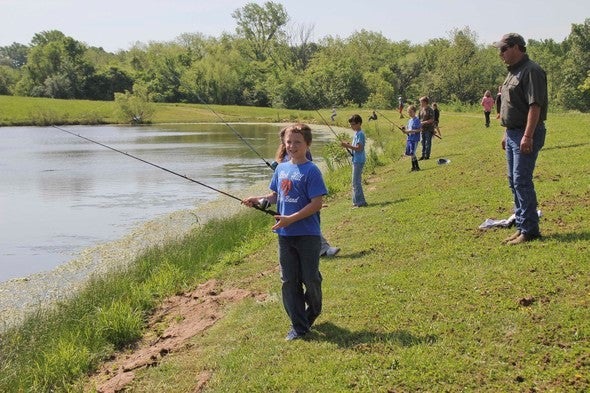 Kids fishing at pond