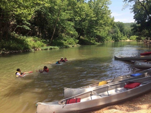 People swimming in river