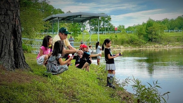 family fishing at Twin Pines pond
