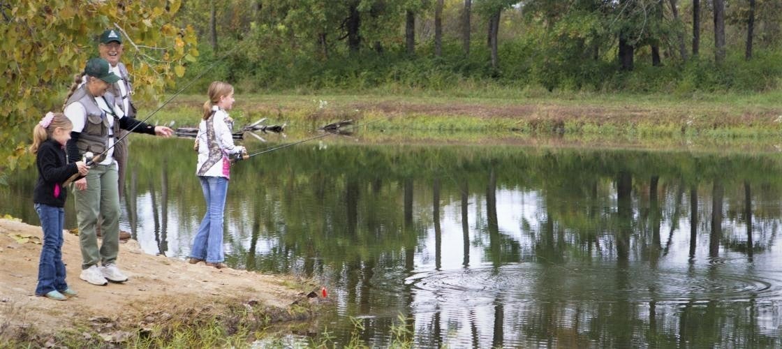 Kids fishing at pond