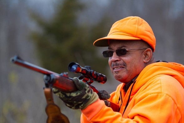 Hunter aims rifle