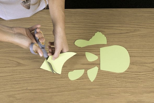 Woman cuts paper craft