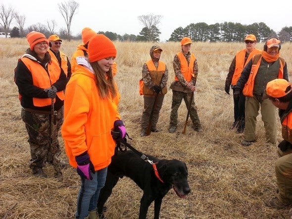 A group gathers to hunt for upland bird game during an MDC clinic