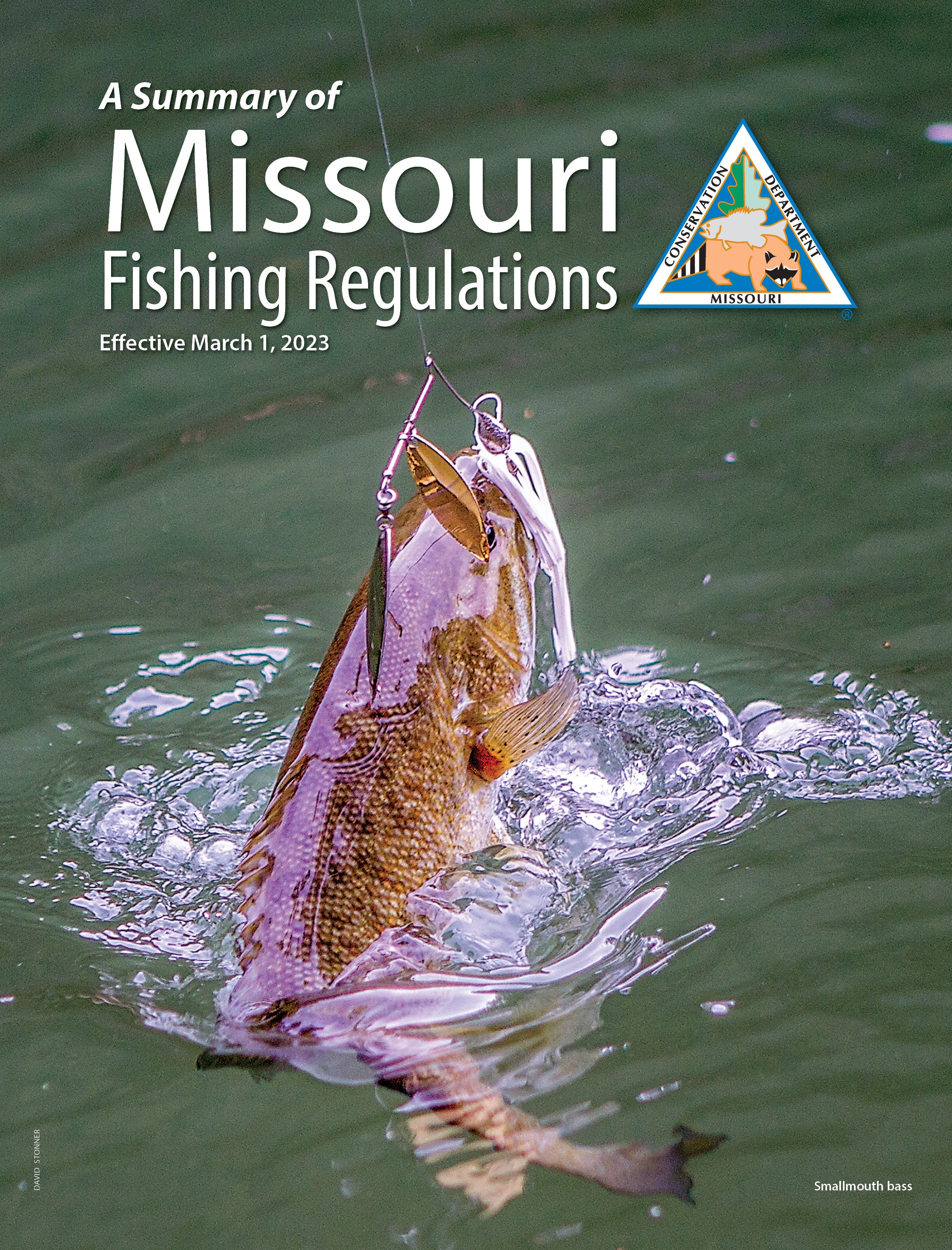Cover of fishing regulation summary showing a smallmouth bass hooked on a line.