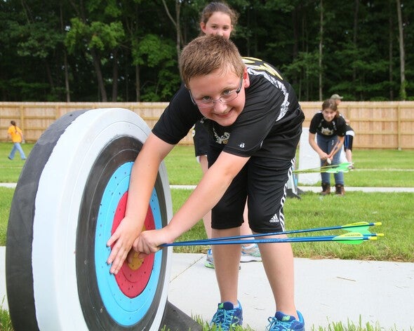 Boy and archery target