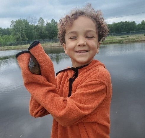 kid with fish