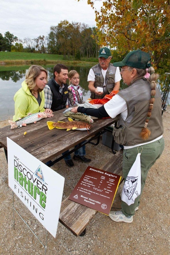 Volunteers teach family to fish
