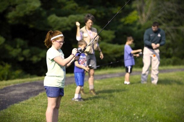 MDC volunteers instruct young anglers to fish