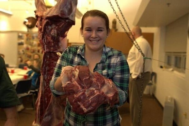Girl with processed deer meat