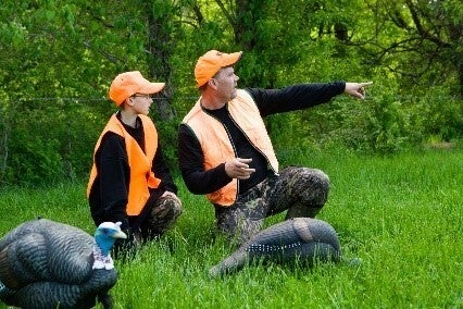 Father and son turkey hunting