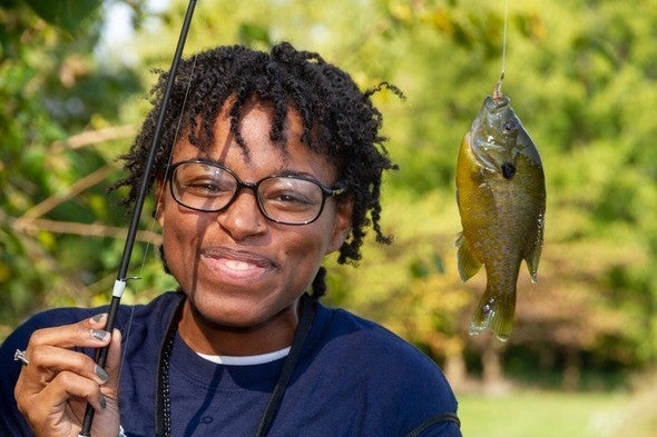Woman with bluegill