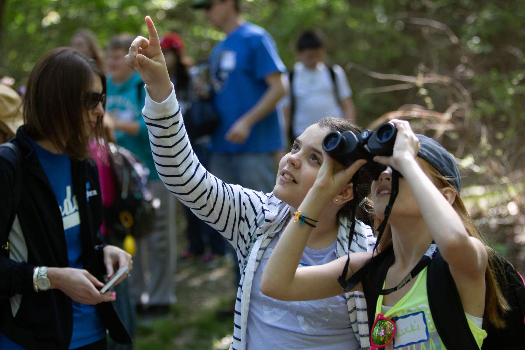 Students bird watch during a Discover Nature Schools classroom session