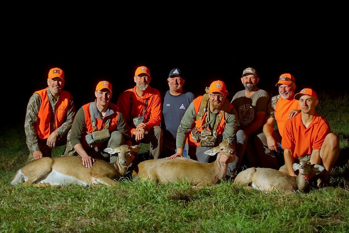 MDC staff, partners, and three new deer hunters pose with their first harvested deer during the Governors Second Annual Mentored Deer Hunt in Putnam County in 2024.