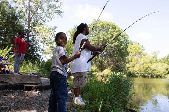 Kid fishing with dad