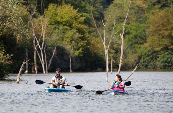 Man and woman stream kayaking