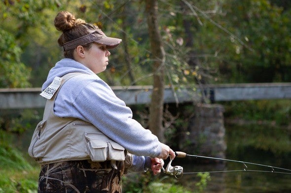 Woman fly fishing at Maramec State Park