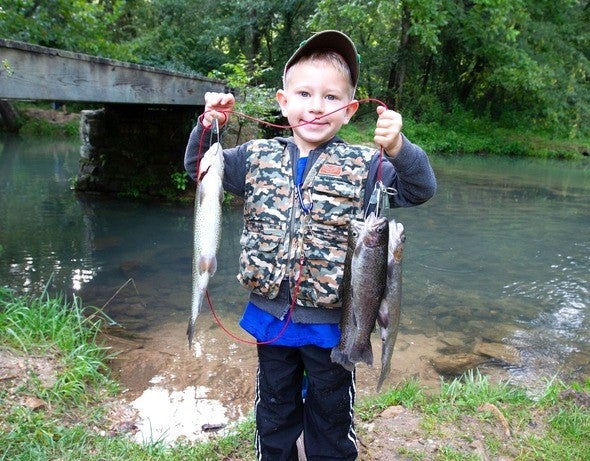 Young boy with trout