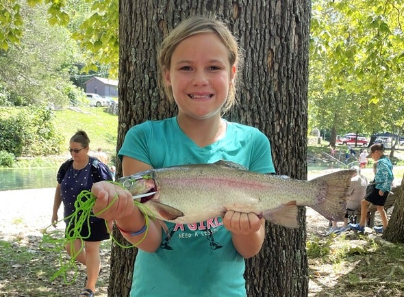 girl holding large trout
