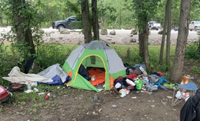 trashed campsite on an MDC area