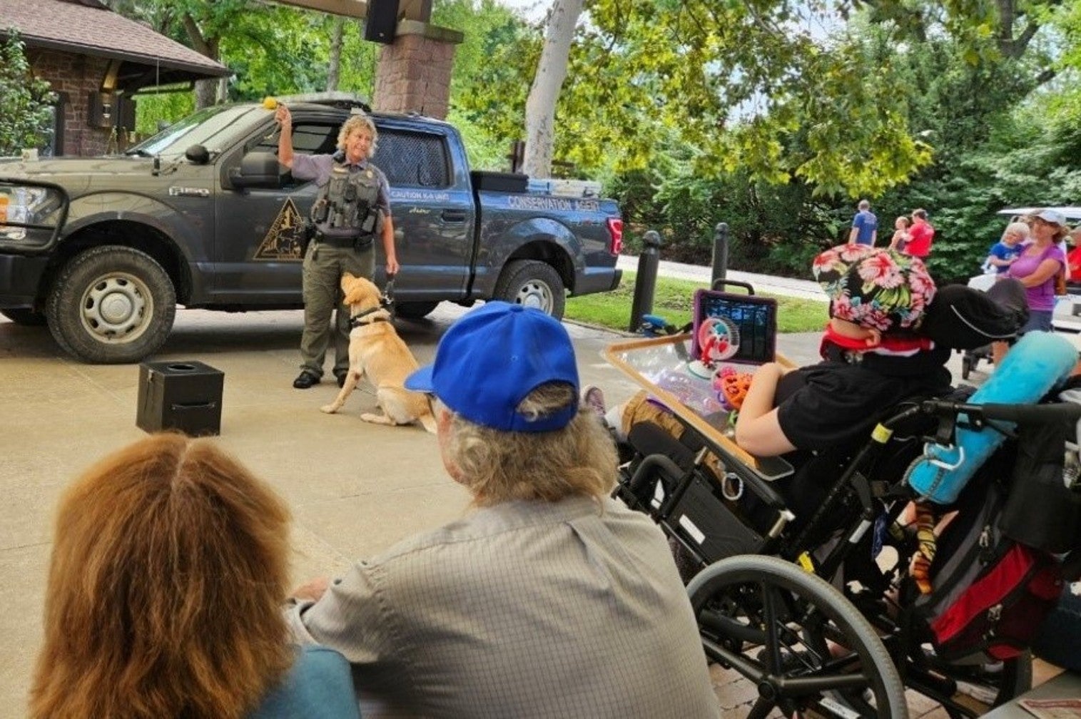 conservation canine with handler at fair