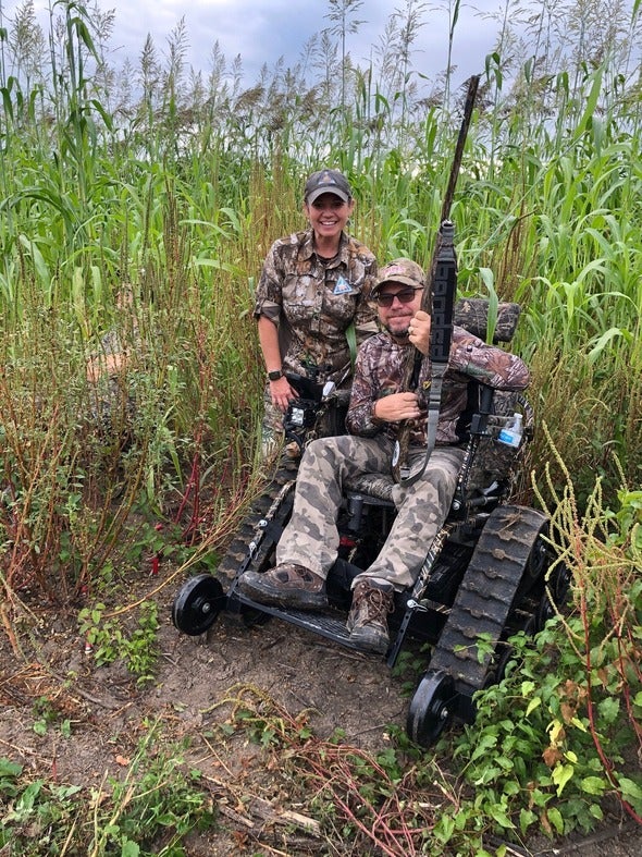 MDC staff with mobility-impaired hunter