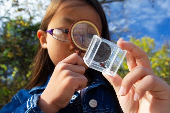 kid looking at bug
