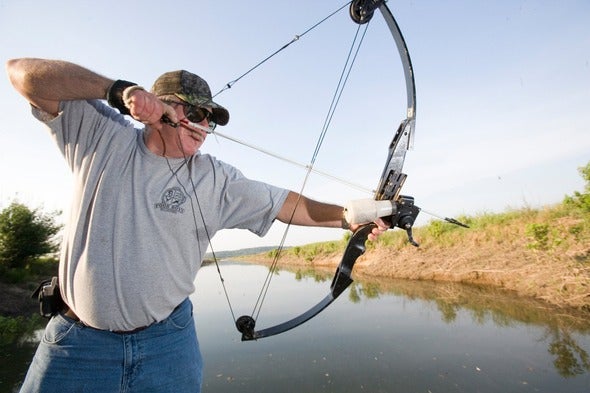 man bowfishing 