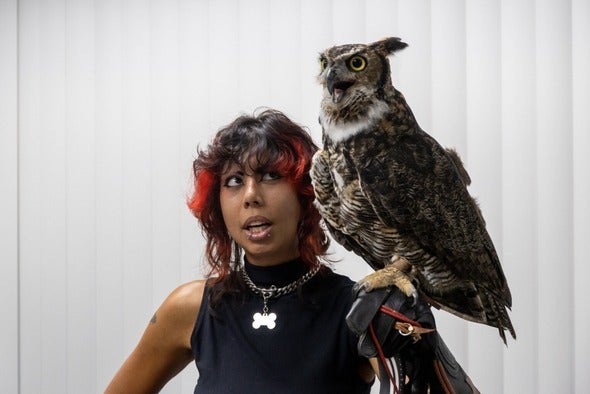 woman holding owl