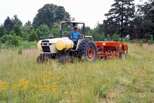 person on tractor in field