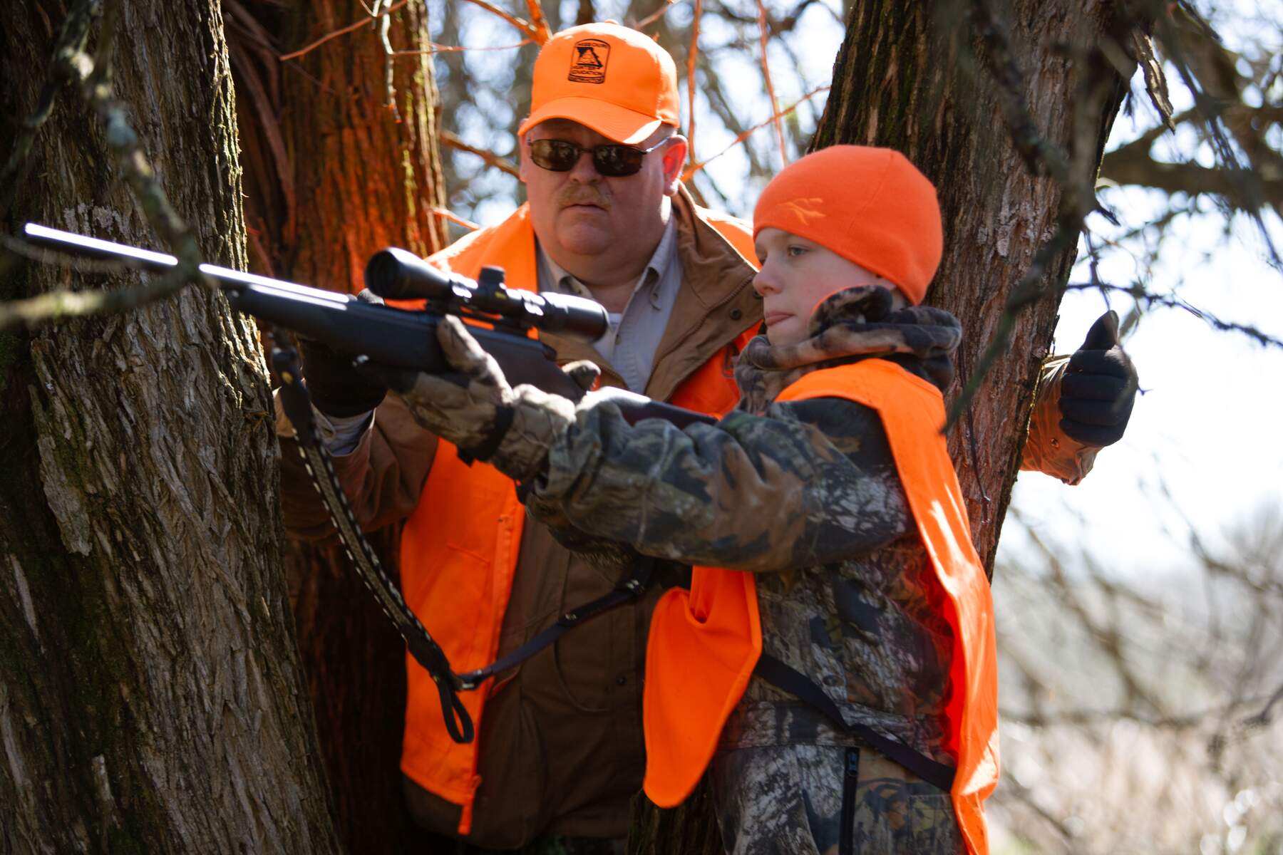 Mike Brooks, MDC mentor, assists a young hunter during a mentored hunt in Springfield.