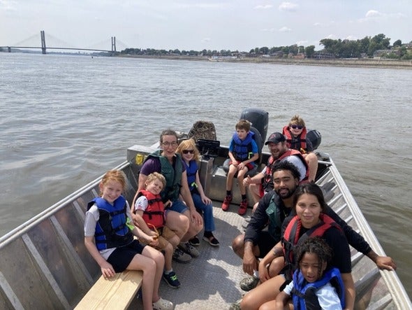 Day on the River attendees enjoy a boat ride
