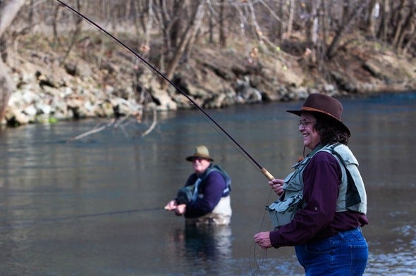two people trout fishing