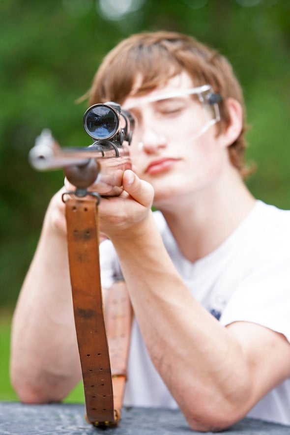 person shooting rifle