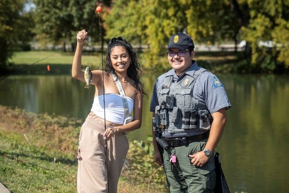 person holding fish with agent