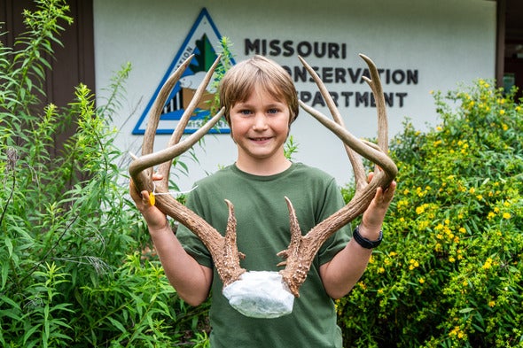 Coleman Wilson shows antlers of buck he harvested