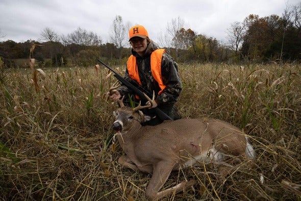 hunter with harvested buck