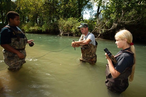 Participants learn how to set a trap during a trapping clinic.