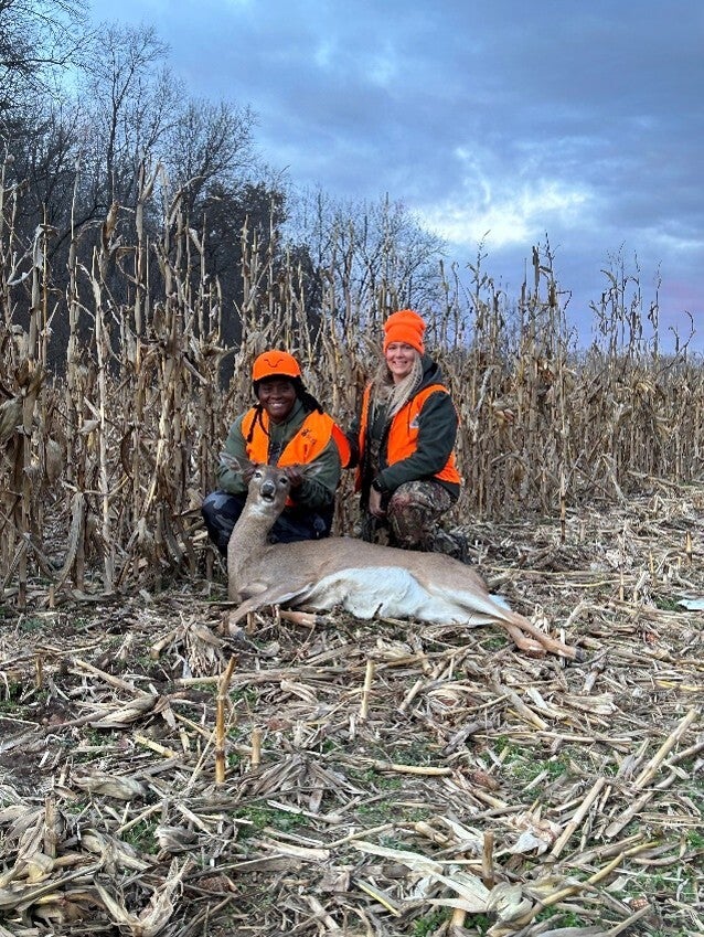 two female hunters with harvested deer 